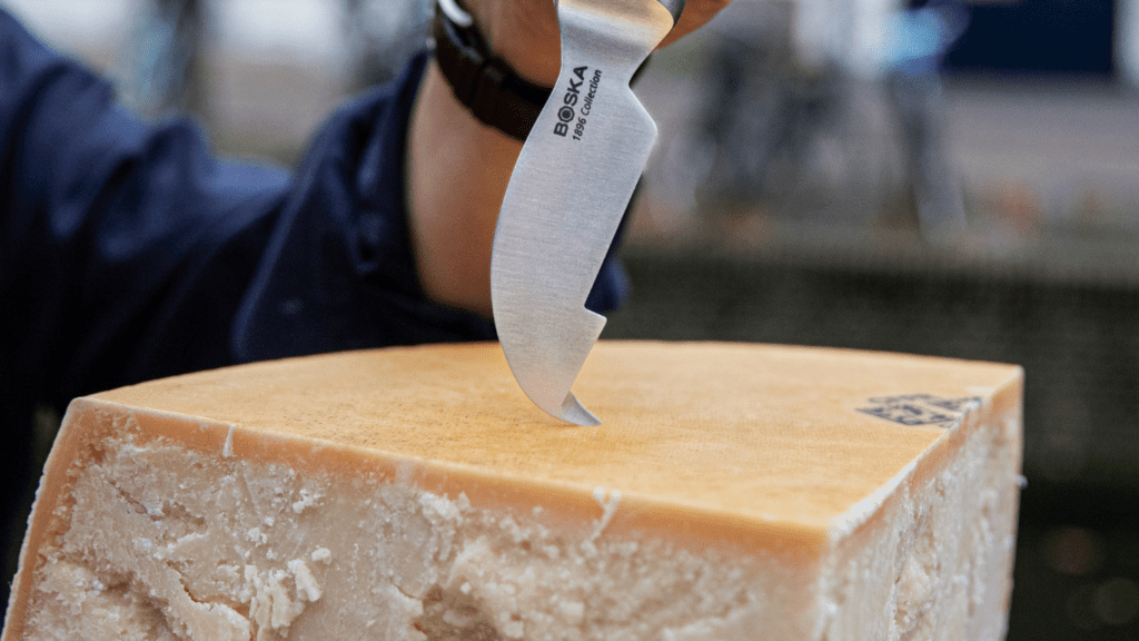 Cutting into Parmigiana Reggiano