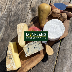 Blue Monk, Other Monk, Monkland & Little Hereford on a cheeseboard with an apple and a pear