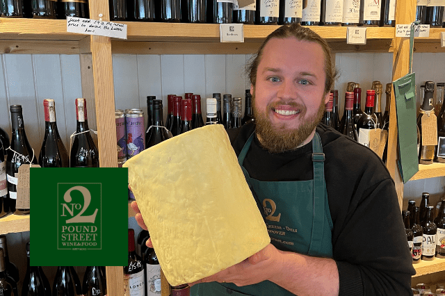 Justin at No 2 Pound Street holding a young Blue Stilton from Cropwell Bishop